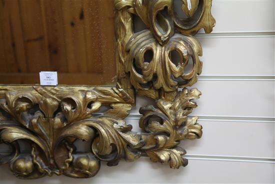 An 18th century Italian carved giltwood wall mirror, 3ft x 2ft 8in.